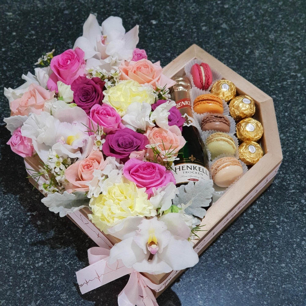 BLOOMS AND CHOCOLATE TREATS HEART BOX Gift Box Bunchilicious Chocolate Fererro Roche & Sparkling wine Macaroons Flowers